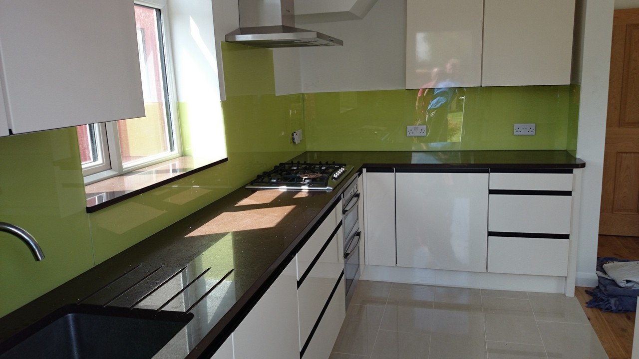 Lime green glass kitchen splashback installed by South Woodford glaziers